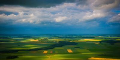 a beautiful landscape of fields seen from a plane